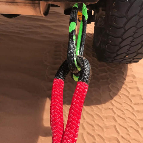 Heavy Duty Three Eighth Inch Synthetic Shackle NexGen PRO Gator Jaw in red and black attached to a vehicle for towing.