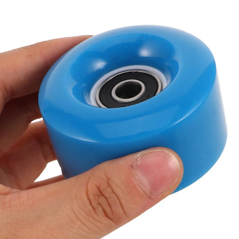 Person holding a dark blue PU wheel from Quad Skate Wheels Replacement Set 8 Dark Blue PU Non Light Up Wheels With Spanner For Outdoor Roller Skates And Scooters