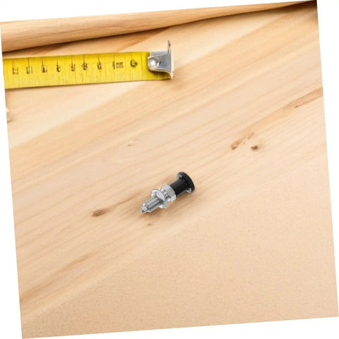 Heavy Duty Tough As Nails Stainless Steel Indexing Plunger With Spring Loaded Knob on wood surface with measuring tape.