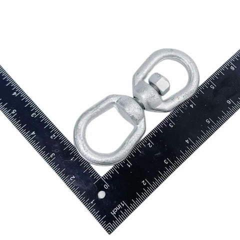 Heavy Duty Three Eighth Inch Eye And Eye Swivel For Marine Mooring And Boat Dock Rigging, galvanized steel, shown with ruler for size.