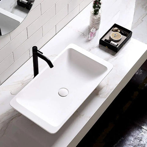 Top view of Slick Polished Artificial Stone Countertop Bathroom Sink With Integrated Drain Heavy Duty Oval Art Basin For Modern Vanity Cabinet Zero Hassle Scratch Proof Finish on marble countertop.