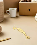 Vintage Zinc Alloy Cabinet Pull Handles 10 Pack For Wardrobes And Drawers on a craft table with yarn and cup