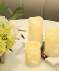 Flameless Wax Pillar Candles Set Of 3 Ivory With Embedded String Lights LED Battery Powered And 5 Hour Cycling Timer