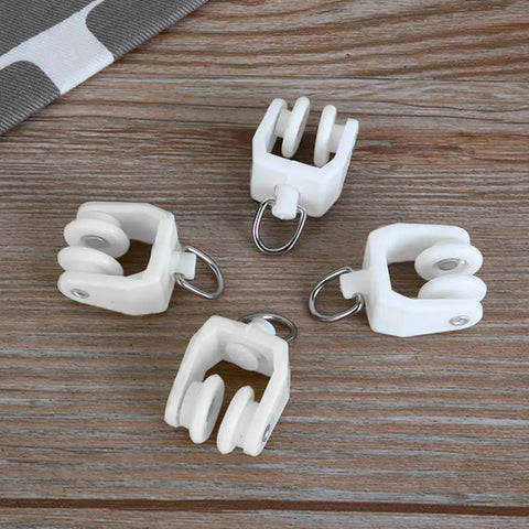 Fifty Piece Heavy Duty Ceiling Curtain Track Rollers With Flexible Bendable Clips And Rock Solid Construction For No Fuss Sliding In Modern Home Spaces on a wooden surface.
