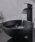 Sleek Black Vessel Sink With Drain Included, 13x13 Round Above Counter Bathroom Vanity Sink, water flowing into porcelain ceramic bowl