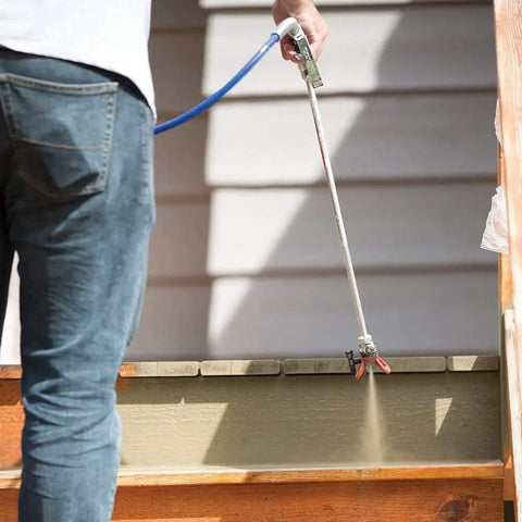 Person using 30 Inch Tip Extension With RAC V Guard For Sprayers, Great For Ceilings And Eaves, Helps You Stay Off Ladders, Includes OneSeal