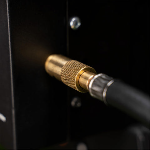 Close-up of brass connection on 3 Foot Propane Adapter Hose With Regulator For 20 Lb Tank, for Tabletop Griddles and Gas Grills.