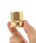 Brass Garden Hose Adapter One Half Inch NPT Female To Three Quarter Inch GHT Female With Double Swivel Connector No Fuss Rustproof Easy To Use Quick Connect For Standard Hose Fittings, brass adapter held in hand