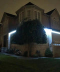 WiFi LED Light Strip Kit 65.6ft Waterproof IP65 All In One Set With 5050 LEDs illuminating house exterior at night