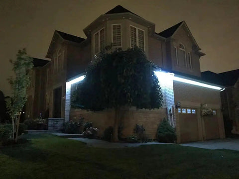 WiFi LED Light Strip Kit 65.6ft Waterproof IP65 All In One Set With 5050 LEDs illuminating house exterior at night