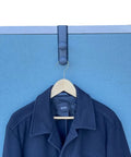 Over-The-Panel Cubicle Partition Wall Garment Hanger With Double Posts For 2.5 To 3 Inch Panels, Black, holding a jacket