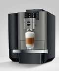 Premium Top Shelf Fully Automatic Coffee Machine Featuring Cold Brew Options And Thirty Four Recipes With Smart Touchscreen preparing a layered coffee drink.
