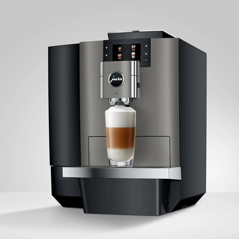 Premium Top Shelf Fully Automatic Coffee Machine Featuring Cold Brew Options And Thirty Four Recipes With Smart Touchscreen preparing a layered coffee drink.