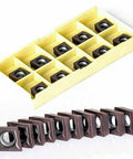 Set of 10 CCMT09T304 inserts for Pro Grade Boring Bar Lathe Holder Set, shown in protective casing for precision turning and roughing.