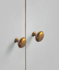 Antique Brass Cabinet Knobs 6 Pack Set, Zinc Alloy Drawer Pulls for Kitchen Cabinets mounted on white doors