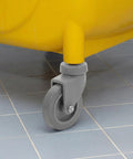 4 Piece Heavy Duty Rubber Swivel Caster Wheels With Threaded Stem And Spring Loaded Setup For Slick Rolling On Mop Buckets Trash Dolly Furniture Carts Grey attached to a yellow mop bucket.