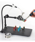 Magnetic Base Welding Bracket with Flexible Third Hand Arm holding a circuit board and soldering iron for precise repairs.