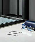 Ten Pairs Glasses Arm Replacement Kit With Metal Temple Tips, Anti Slip Eyewear Grips for Eyeglasses and Sunglasses next to glasses case