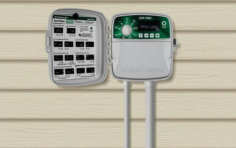 TM2-6 Station Indoor Outdoor Controller for Sprinkler Systems with open interface showing controls on a wall mount