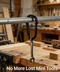 Heavy Duty Black Carabiner Clip Built Tough For 900lbs, 3 Inch Steel D Shaped Snap Hook securing a wrench on a workbench.