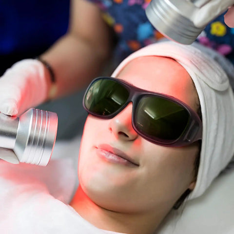 Kickass Laser Safety Goggles With Red Light Therapy Coverage And High Optic Density Certified Eyewear For Grease Monkey Shop Use And Fiber Beam Protection That Keeps Your Vision Rock Solid worn by a woman during a treatment.