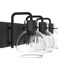 Side view of Three Light Matte Black Farmhouse Vanity Lighting Fixture With Clear Glass Globes For Bathroom Bath Lighting