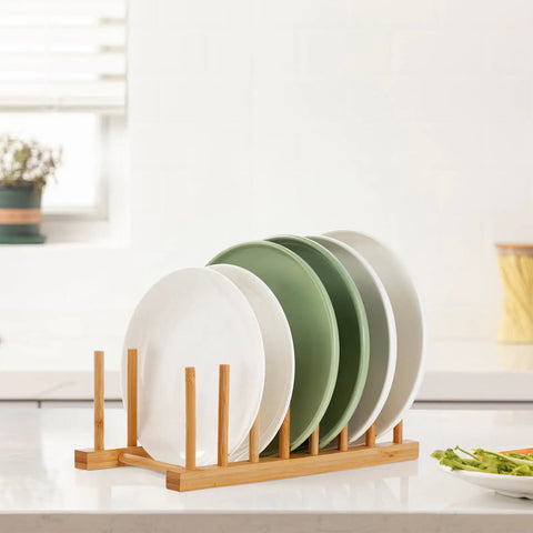 2 Pack Premium Bamboo Dish Rack And Plate Holder With 7 Slots To Level Up Your Kitchen Game displaying plates on a wooden organizer.