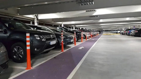Heavy Duty Flexible Bollard Built Damn Tough For Busy Parking Lots Takes Serious Beating And Springs Back in a crowded parking lot.