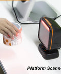 Hand using Desktop Platform Barcode Scanner with CMOS auto sensing and continuous QR reading, 640x480 resolution, USB Type B.