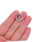 Tough As Nails Stainless Steel Spring Lock Washers M10 Split Ring Kit 100 Pieces held in hand, showing detailed design for precision fasteners.