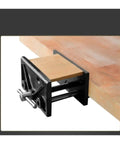 Heavy Duty 6.5 Inch Table Clamp With Rock Solid Quick Release Vise mounted on a wooden bench holding a piece of wood securely.