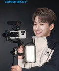 Person holding Scorp Mini 3 Gimbal Stabilizer for Smartphones with AI Tracking, built-in cooling fan, 2 kg payload.
