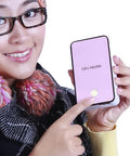 Person holding a pink Mini Portable Room Heater For Desk And Office, Energy Saving Quiet Electric Fan Heater, showcasing compact design.