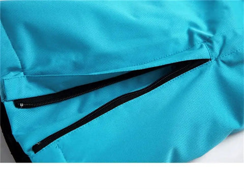 Close-up of pocket zipper on blue All Terrain Snow Bibs for Men and Women Waterproof Breathable Snow Pants with Straps for Skiing