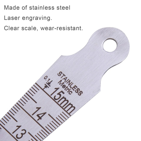 Stainless steel taper gauge with metric and imperial scales; front view showing 15 mm mark and mounting hole.