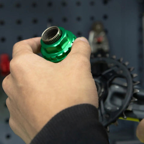 Hands using 12 Speed Front Direct Mount Chainring Removal Tool For MTB And Road Cranksets CNC Machined Lock Ring Installer