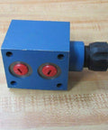Bosch Rexroth R900978977 AF6EA40Z250V hydraulic valve with black push and turn button, side view showing NPT ports.