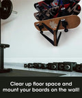 Five Tier Skateboard Wall Mount Rack With Rustic Wood And Black Steel Hooks For Tight Garages displaying mounted longboards.