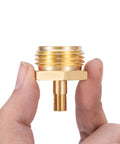Person holding Beast RV Brass Blow Out Plug Adapter 3/4 Inch GHT Female And Male Garden Hose Quick Connect