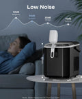 Silonn countertop ice maker in black with white scoop and side handle on a round table