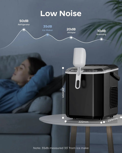 Silonn countertop ice maker in black with white scoop and side handle on a round table
