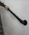 Heavy Duty Rustic Industrial Pipe Railing And Beefy Wrought Iron Handrail for Porches Decks Stairs installed on wall.