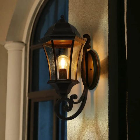 Large Bronze Aluminum Outdoor Wall Light Fixture For Porch And Exterior Doors Old School Lantern Sconce With Clear Seeded Glass Wall Mount Exterior Lighting Weather Resistant Front Porch Glow glowing at night