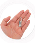 Top Shelf Universal Replacement Zipper Pull Heads 20 Piece Metal Kit With Sleek Detachable Tabs For Backpacks Purses Jackets And Luggage Repairs That Are Pure Gold, Silver metal zipper pull in hand.