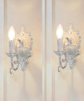 ZIRALIO Farmhouse Vintage Wall Sconce for Bedroom, 2-Pack in distressed white with candle-like bulbs on decorative backplate.