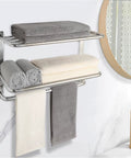 3 Tier Bathroom Towel Rack Wall Mount In Brushed Nickel SUS 304 Stainless Steel Tall Tower Holder For Towels Robes And Clothes Rust Proof 23 Inch Towel Shelf And Hanger Space Saving Organizer Must Have, featuring folded towels and hanging robes, installed on a bathroom wall next to a mirror.