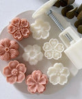 White Cherry Blossom Mooncake Mold With 30g Hand Press Cookie Stamp six petal designs on a round plate.