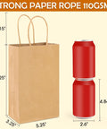 Bulk 200Pcs Kraft Paper Gift Bags With Handy Handles 5.25x3.25x8.25 Inches Durable Brown Gift Wrap Bags For Small Business Birthday Favors Shopping Retail Use Perfect For Party Favors And Bulk Packaging For Retail Shops next to soda cans for size comparison.