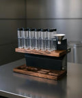Premium Two Tier Coffee Bean Storage Rack With Wooden Base And Twelve Clear Glass Jars Featuring Air Release Vents For Crisp Freshness And Top Shelf Kitchen Counter Organization Straight Fire Setup on modern kitchen countertop.