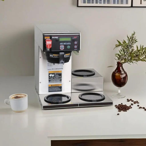 Front view of Dual Voltage Commercial 12 Cup Coffee Maker With Back To Back Brews Three Warmers Large 200 Oz Tank Programmable Brew Level And Temperature Cold Brew Lockout Grey Finish Built For Busy Cafes And Offices